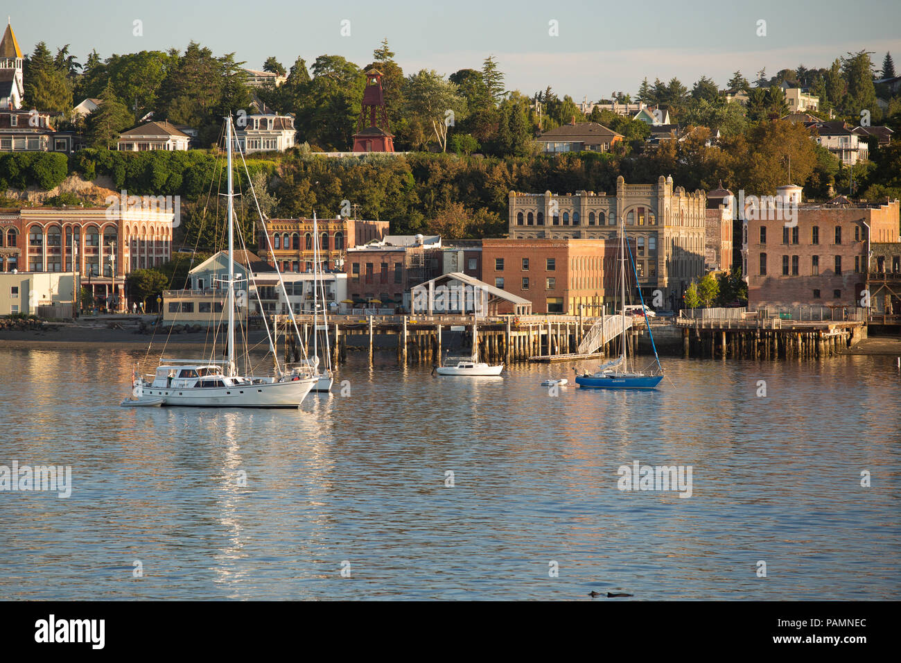 Port Townsend waterfront view from water with sailing boats at anchor. Stock Photo