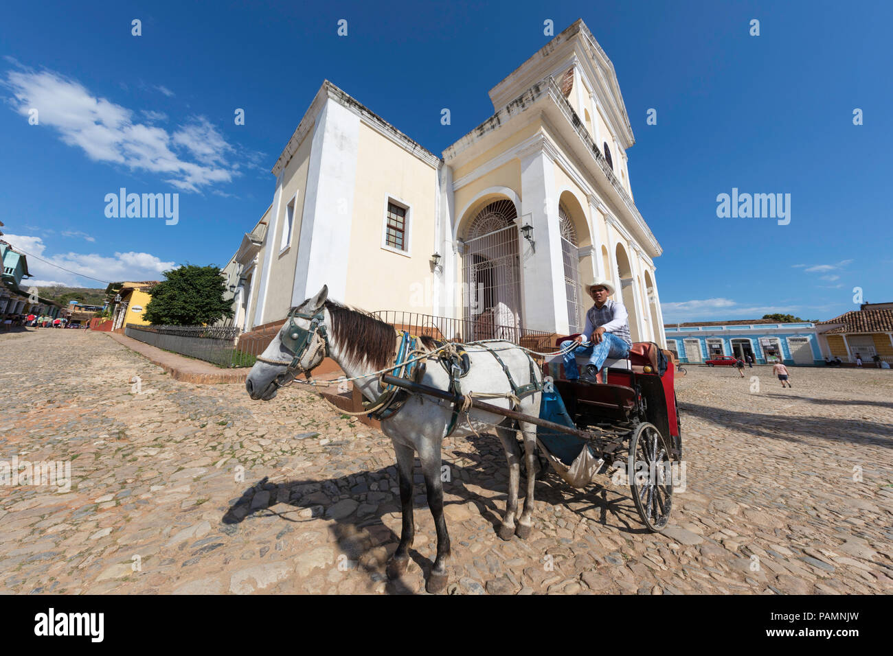 A horse-drawn cart known locally as a coche in Plaza Mayor, in the UNESCO World Heritage town of Trinidad, Cuba. Stock Photo