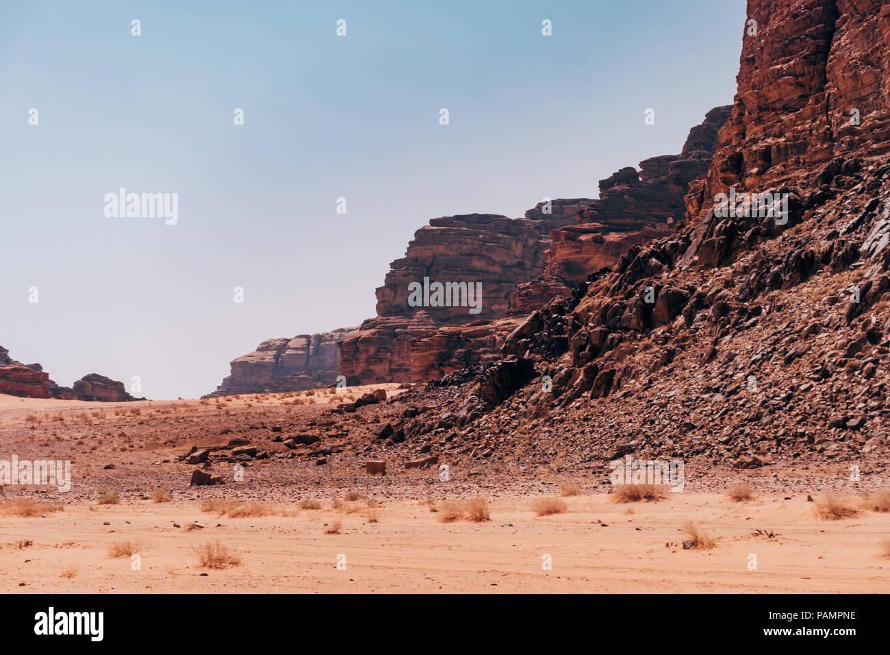 the red orange rocks and sand of the desert near the 'Seven Pillars' in ...