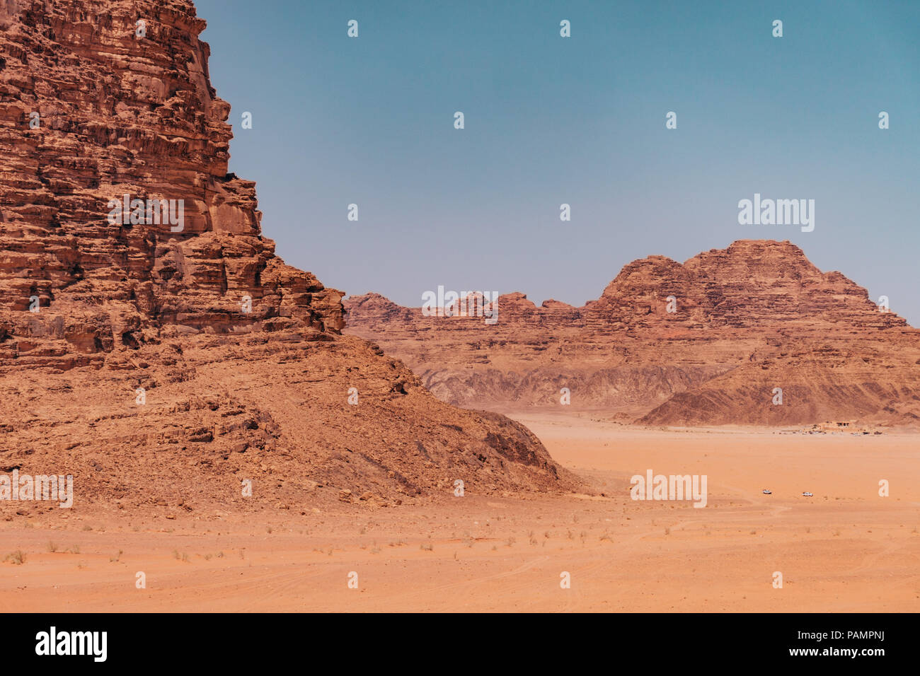 the red orange rocks and sand of the desert near the 'Seven Pillars' in ...