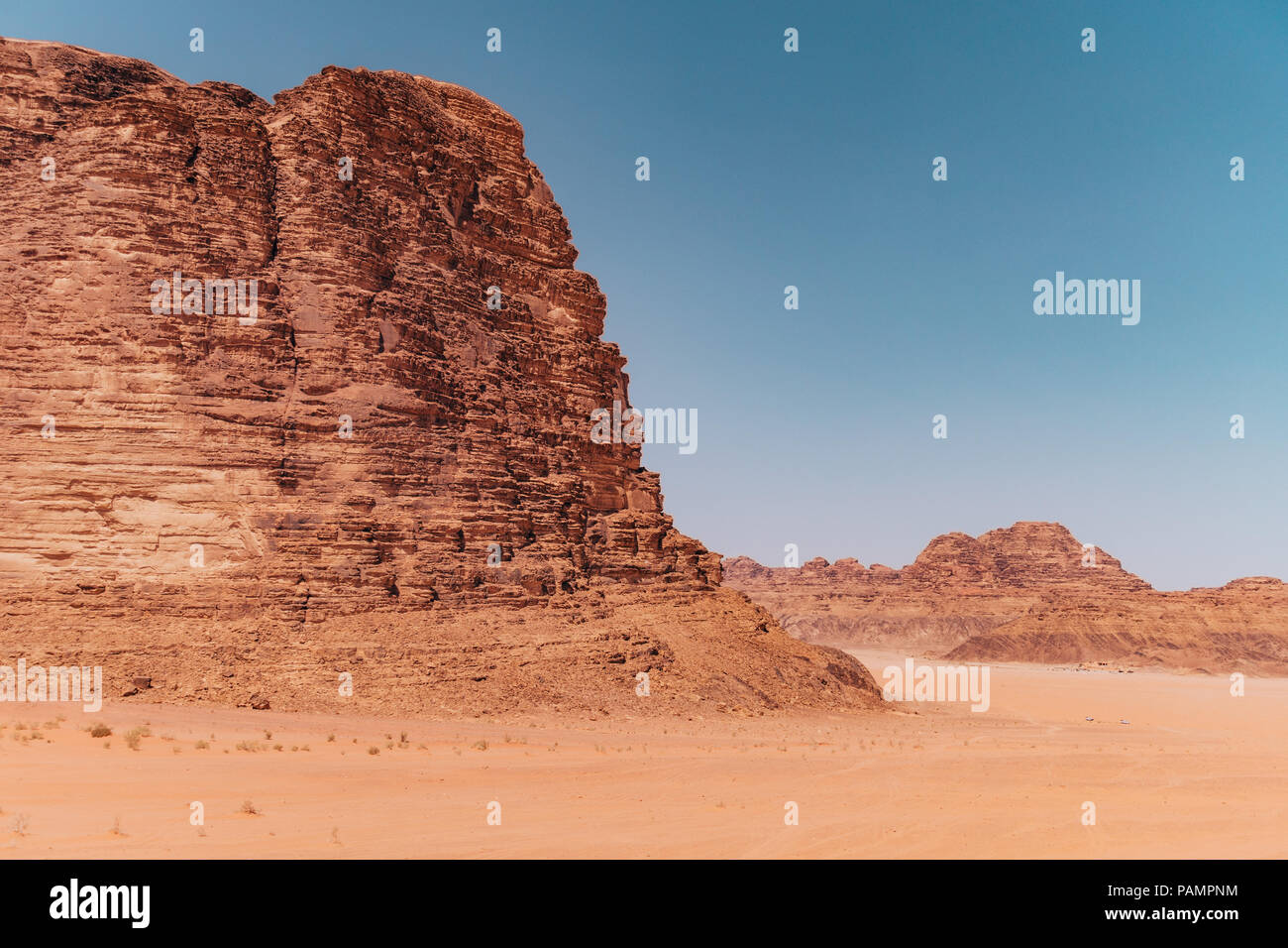 the red orange rocks and sand of the desert near the 'Seven Pillars' in ...