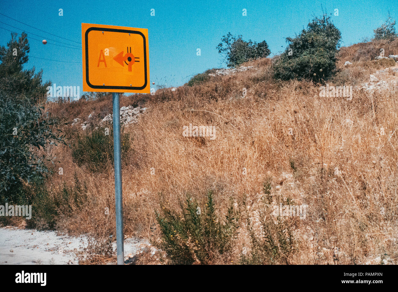 a road sign marks the roundabout turnoff into Area A (under control of the Palestinian Authority) in the West Bank Stock Photo