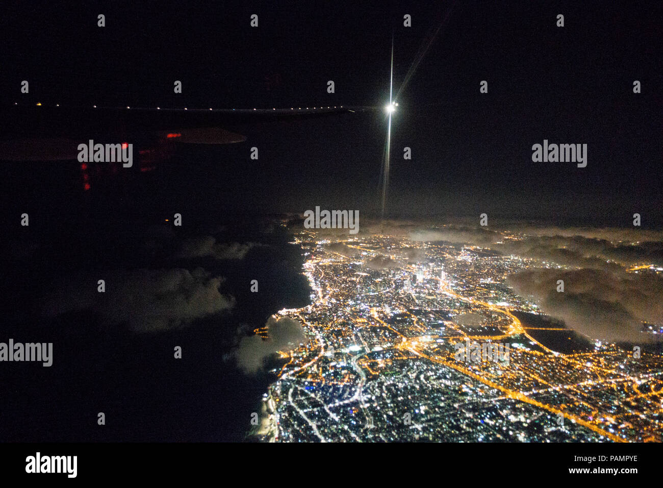 Tel Aviv as seen from an aircraft window departing at night Stock Photo