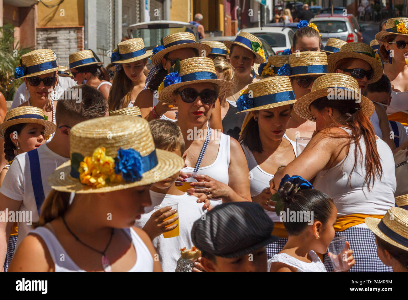 Arroyo de la Miel, Spain - 17/6/2018: Women in straw boaters in the fiesta parade. There are many festivities throughout the year. Stock Photo