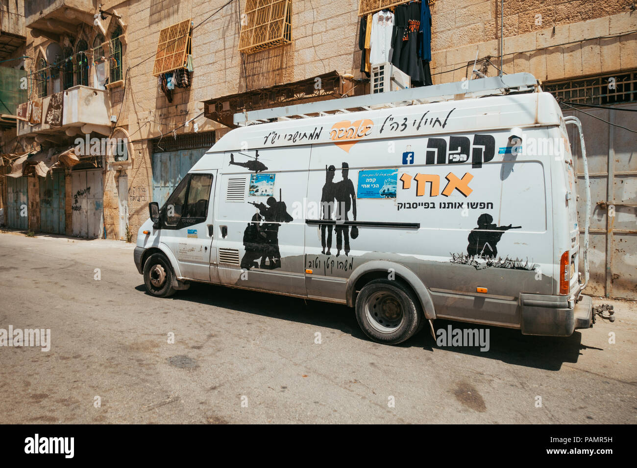 A mobile ice cream and snack vendor distributes refreshments to Israeli soldiers in Hebron, West Bank, Israel Stock Photo