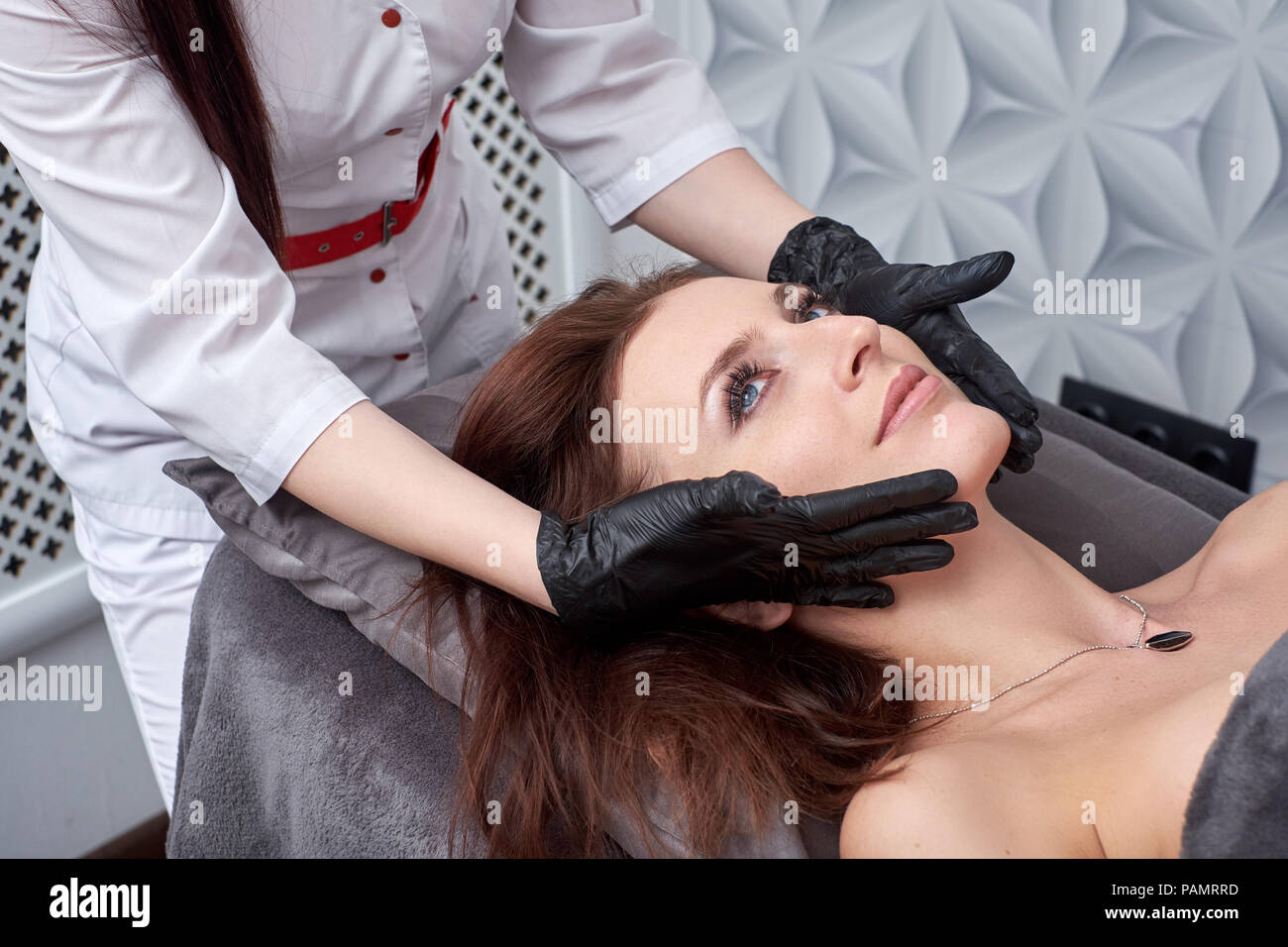 Massage and facial peels at the salon using cosmetics Stock Photo