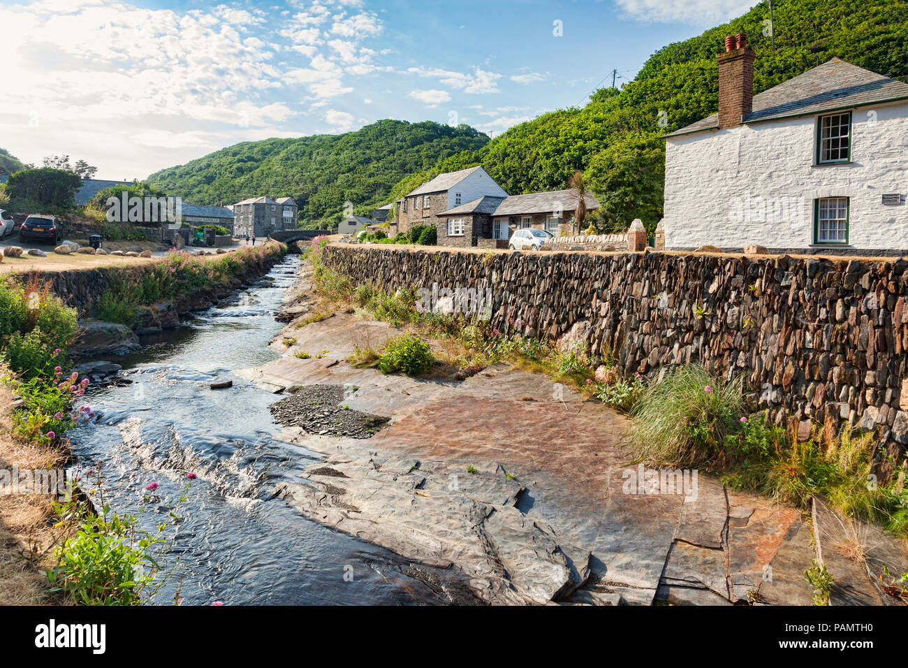 2 July 2018: Boscastle, North Cornwall, UK - the coastal village of Boscastle, with cottages and the River Valency running through it with a slate str Stock Photo