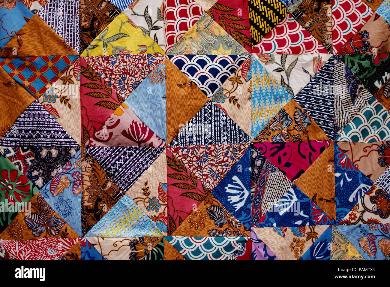 Background texture of pieces of old carpets with stitching thick