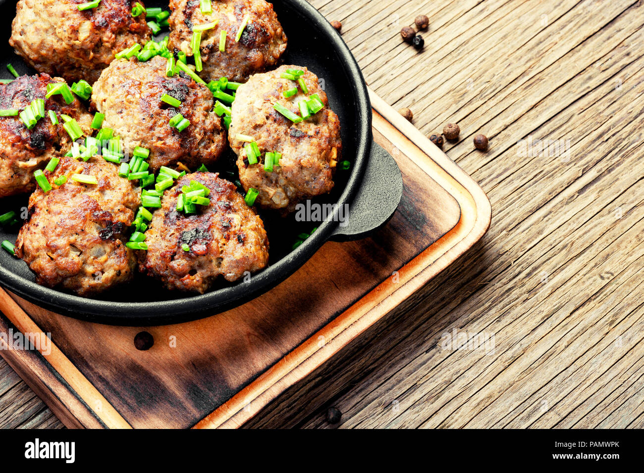 Roasted beef meatballs in castiron skillet.Delicious cutlet Stock