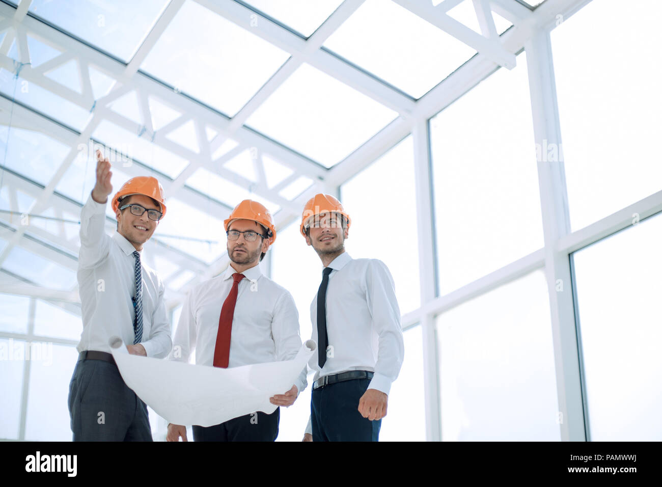 architect shows the customer a new building Stock Photo - Alamy