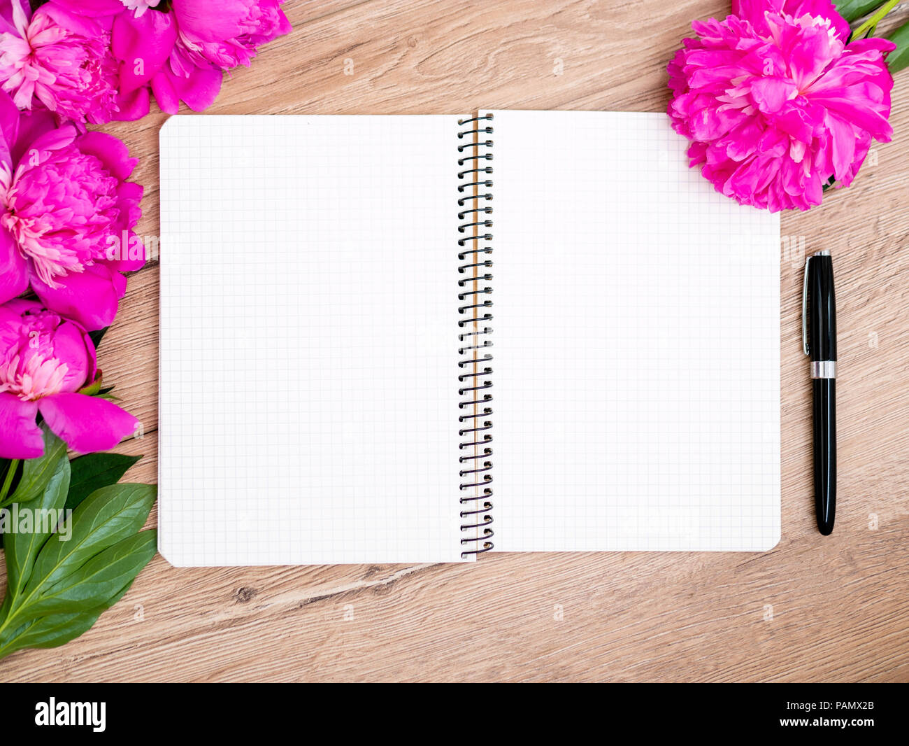 Pink floral assorted pink flower on wooden background with notepad free