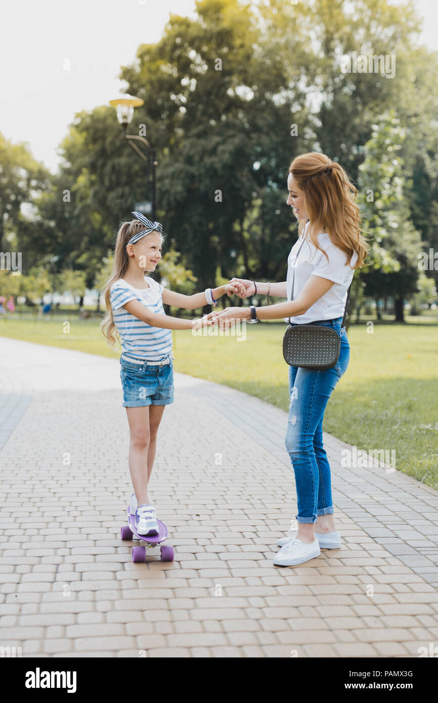 Fashionable mother spending her leisure time with her girl Stock Photo