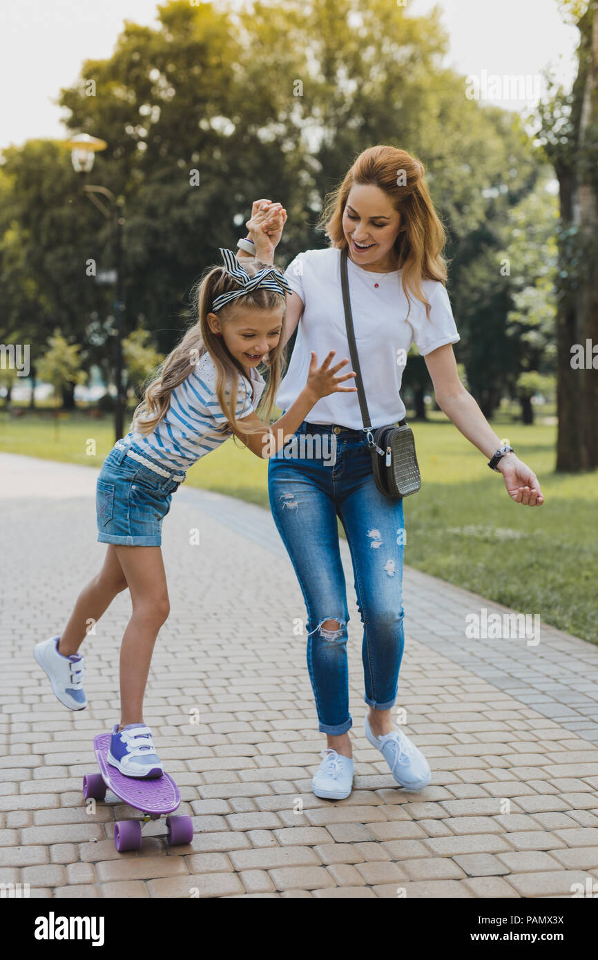 Blonde-haired daughter leading active lifestyle Stock Photo