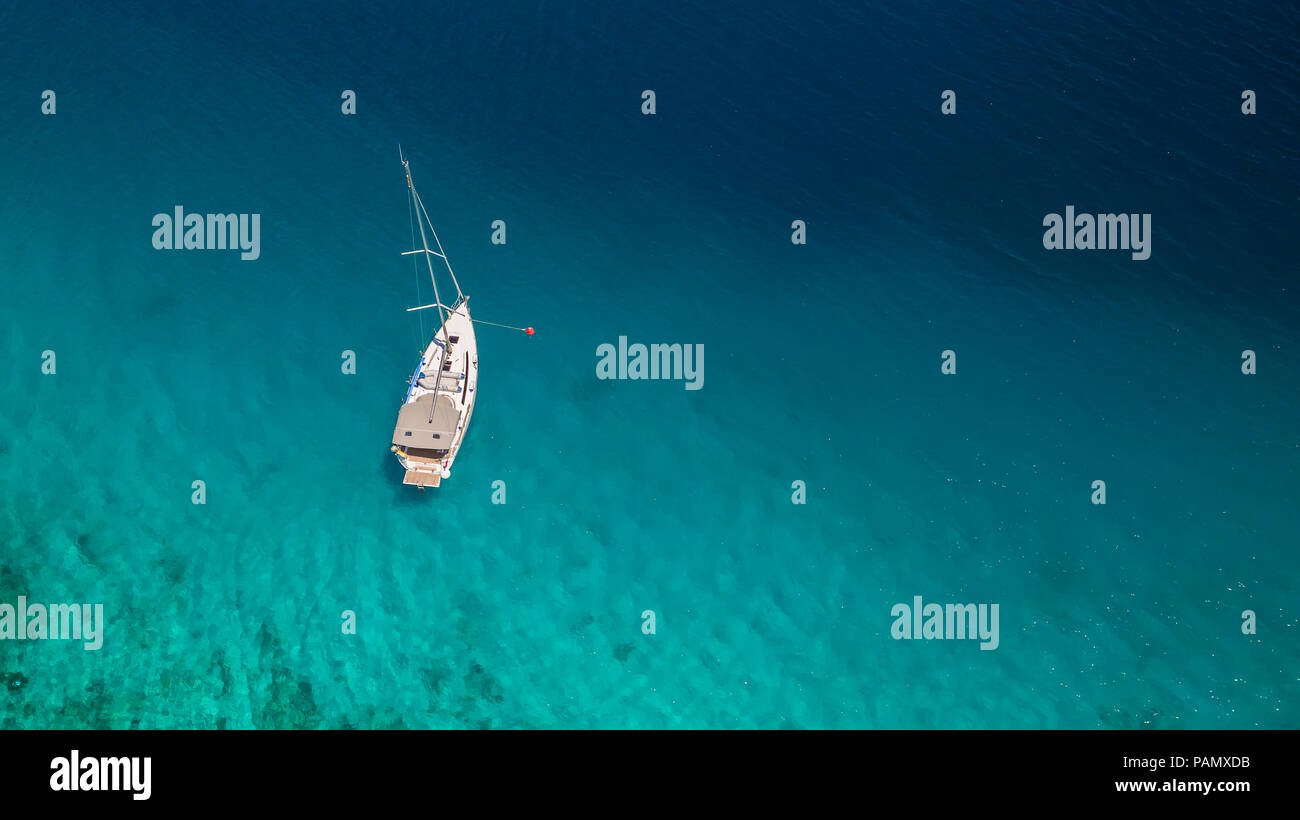 Sailing boat on open water, aerial view. Active life style, water transportation and marine sport. Stock Photo