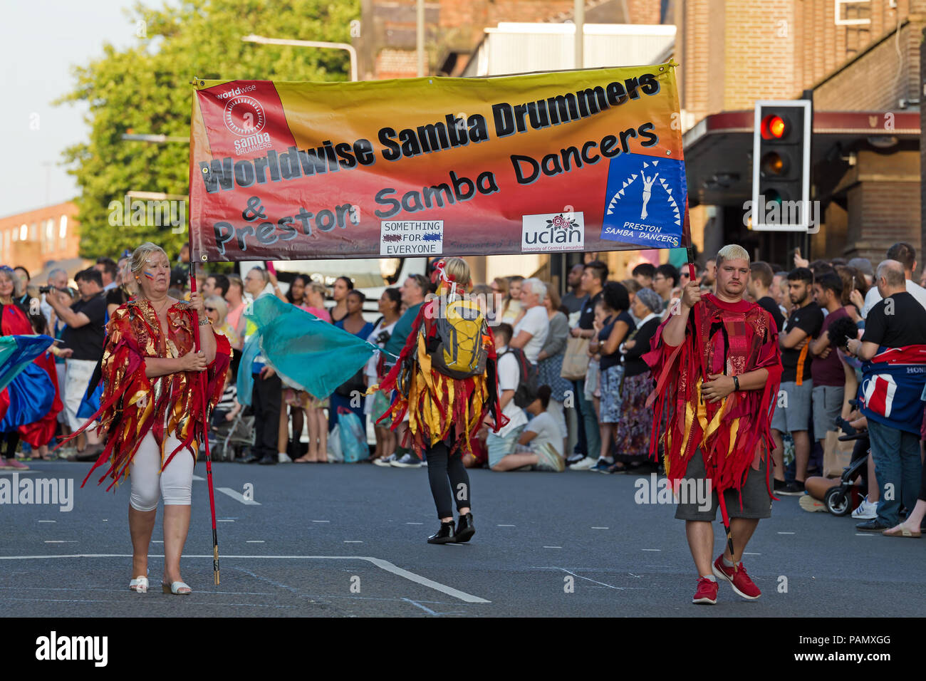 Samba Dancers in colourful costumes parade through the streets of
