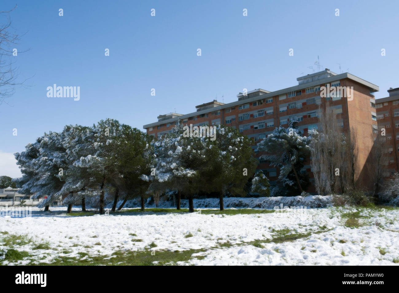 Apartment Block And Public Garden Covered In Snow In Rome During