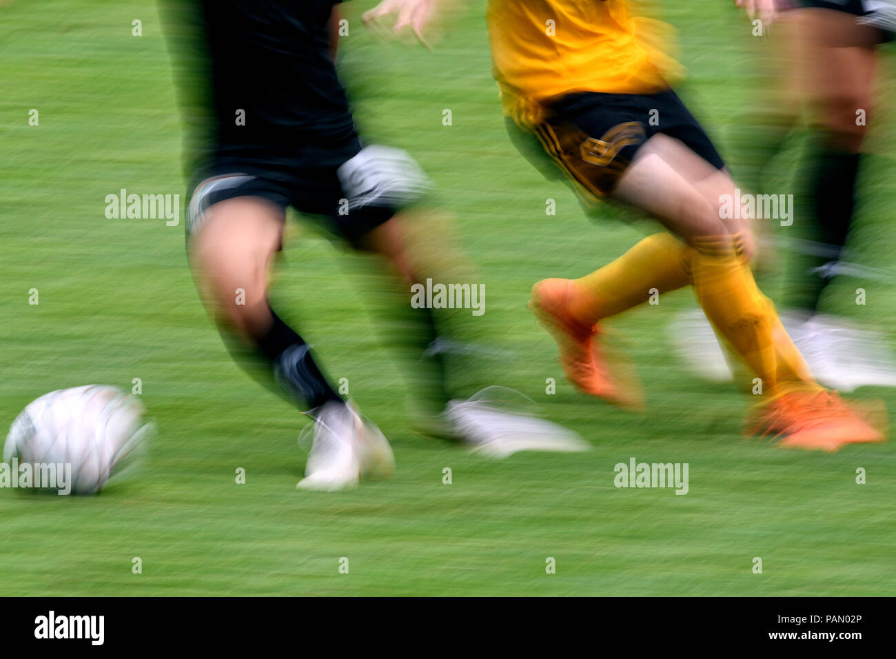 Soccer feature, legs and ball Stock Photo