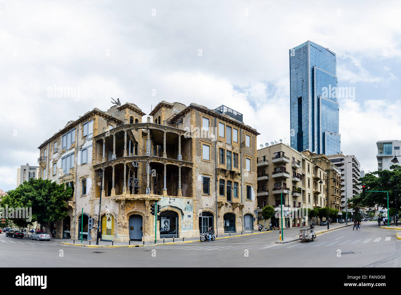 The old historic war damaged Beit Beirut or Barakat Building, and Sama Beirut, tallest modern skyscraper in Lebanon, Sodeco Achrafieh, Lebanon Stock Photo