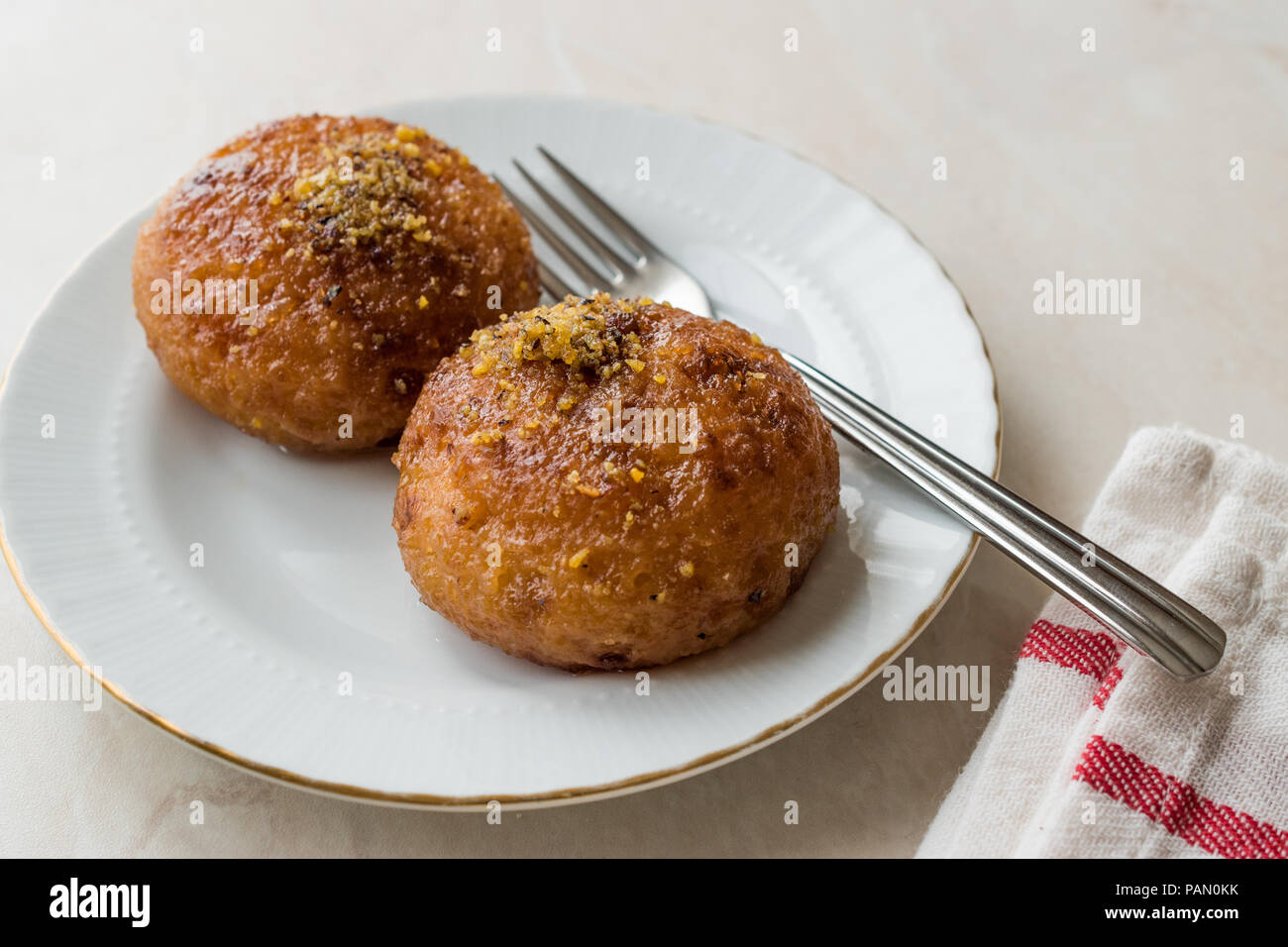 Turkish Kemalpasa Cheese Dessert / Lor Tatlisi with Pistachio Powder and Sherbet. Traditional Dessert. Stock Photo