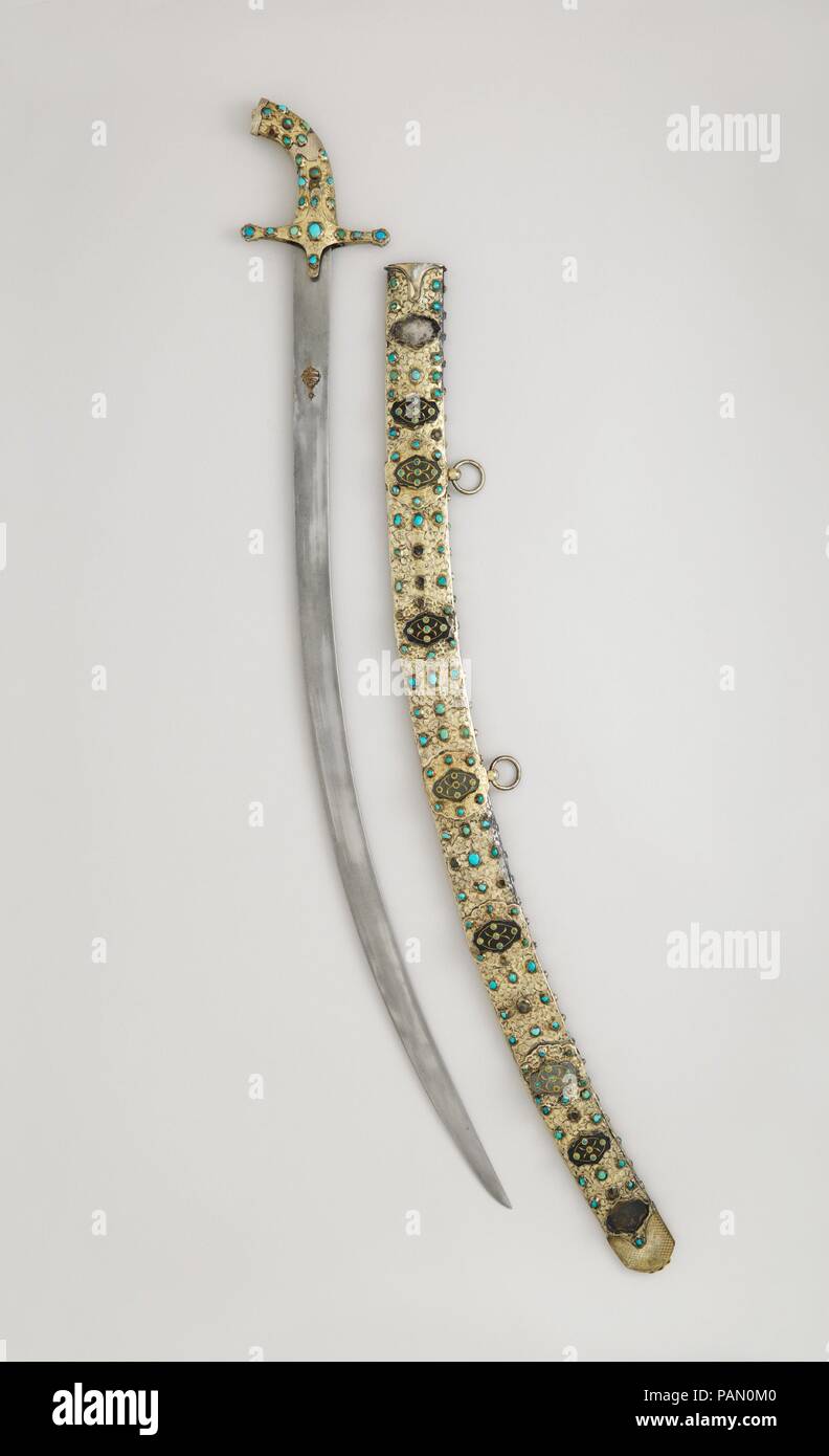 Scimitar with Scabbard. Culture: Hilt and scabbard, Turkish; Blade, Iranian. Dimensions: H. with scabbard 42 1/16 in. (106.8 cm); H. without scabbard 40 1/8 in. (101.9 cm); H. of blade 35 in. (88.9 cm); Wt. 4 lb. 4 oz. (1928 g); Wt. of scabbard 2 lb. (906 g). Date: late 16th-17th century.  This is a typical Ottoman presentation saber of the seventeenth century. Many similar weapons, as well as shields and complete horse trappings similiarly mounted in silver-gilt and set with jade plaques and turquoise, were taken as booty after the unsuccessful Turkish seige of Vienna in 1683. Museum: Metropo Stock Photo
