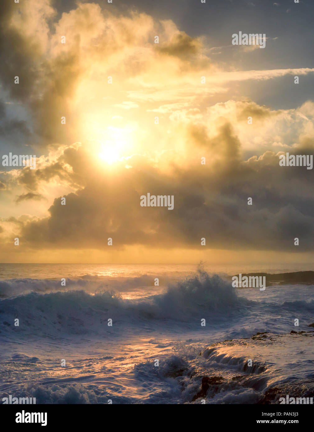 Waves and sunrise. The Puna Coast, Hawaii, The Big Island Stock Photo