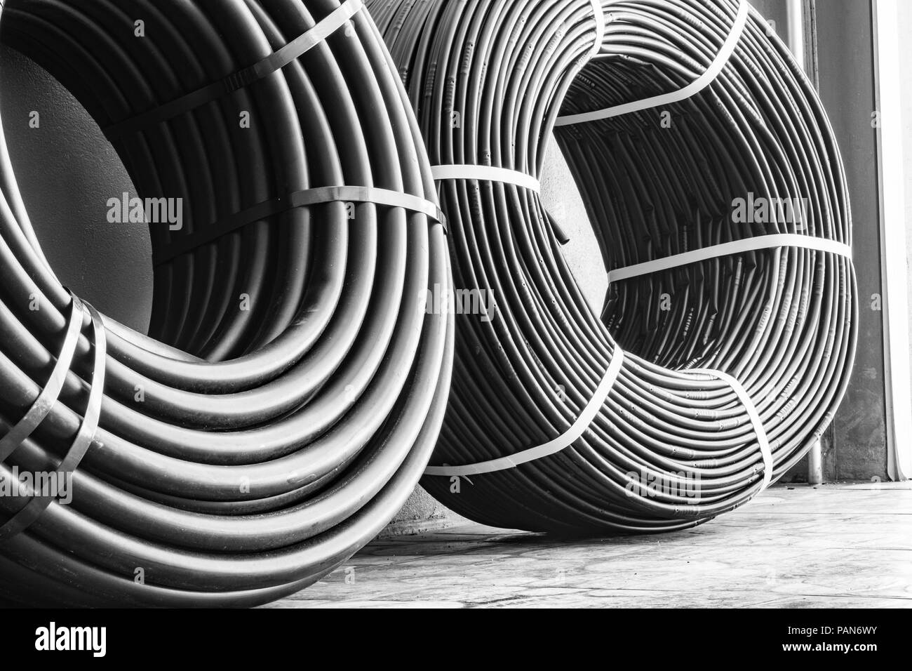 Two rolls of Drip Irrigation Hoses used for efficient water saving system for agricultural crops. Stock Photo
