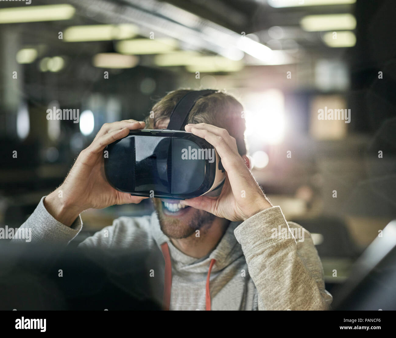 Man working with VR glasses and laptop Stock Photo