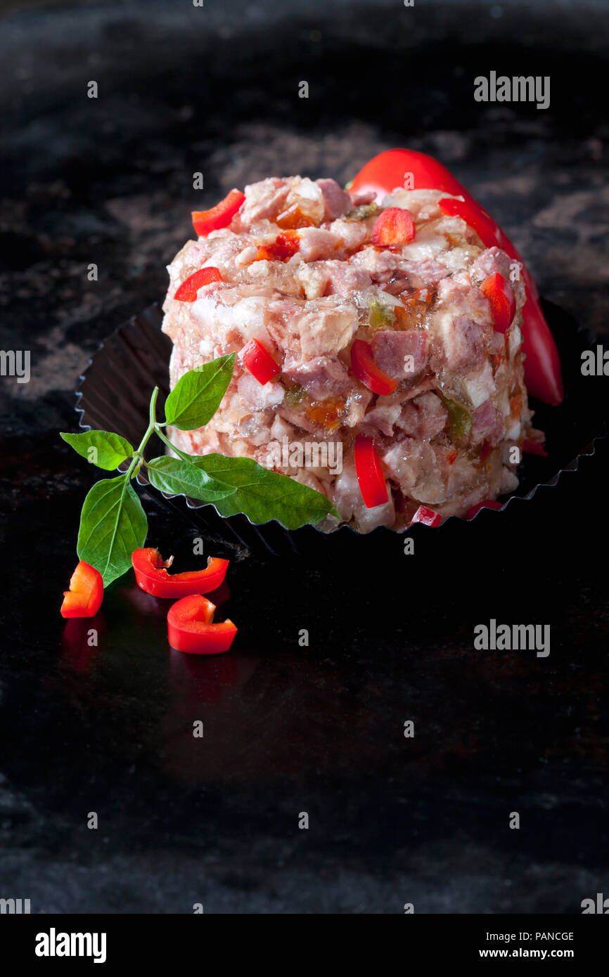 Pork in aspic with red bell pepper Stock Photo