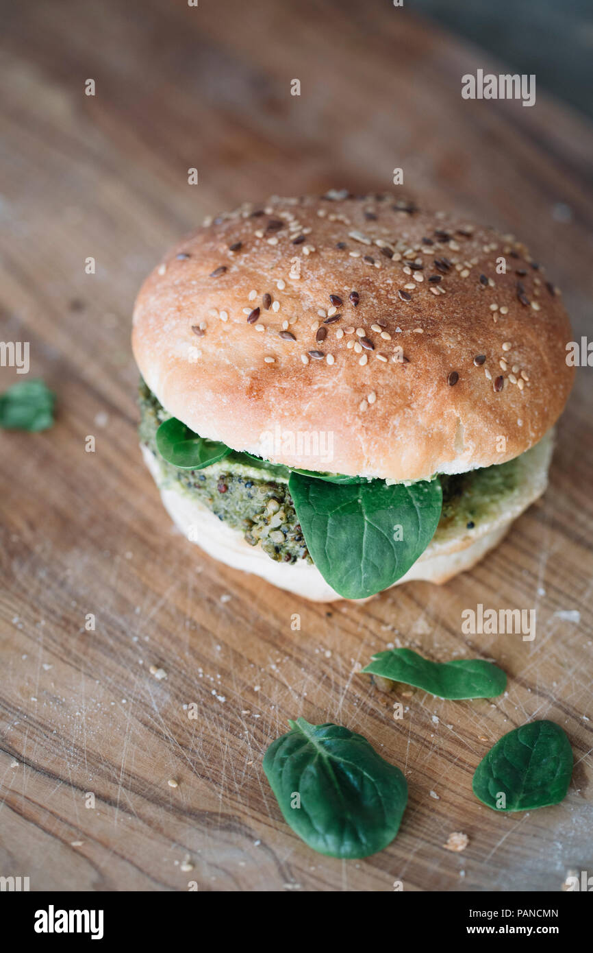 Homemade vegan burger with avocado cream spinach and fritter Stock Photo
