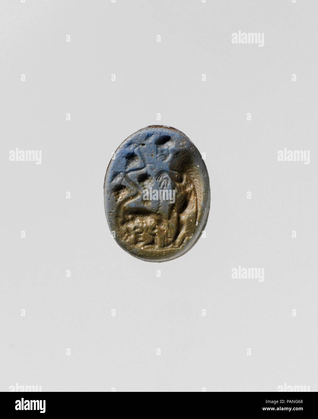 Opaque blue glass oval engraved gem. Culture: Roman. Dimensions: Overall: 11/16 x 9/16 in. (1.7 x 1.4 cm). Date: 1st century B.C..  According to tradition, Rome was founded in 753 B.C. by the twins Romulus and Remus. Sons of the god Mars and a mortal woman named Rhea Silvia, a direct descendant of Aeneas, the twins were abandoned by their uncle in the Tibur river. A she-wolf discovered them on the banks of the river and  suckled them until they were taken in by a passing sheperd, Faustulus. Faustulus raised the boys together with his own twelve children until they decided to found a city of th Stock Photo