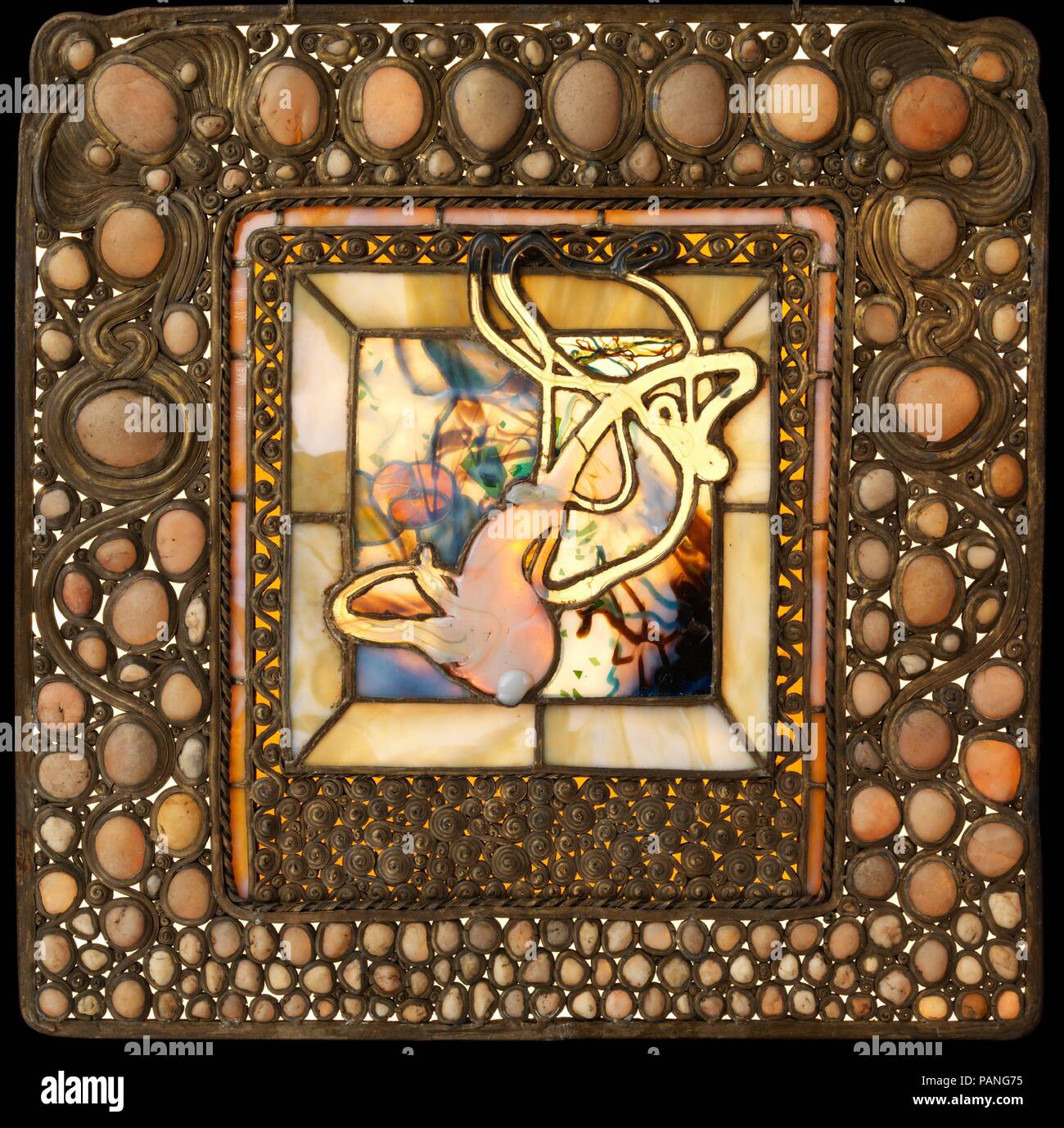 Squash Window with Pebbles. Artist: Louis Comfort Tiffany (American, New York 1848-1933 New York). Culture: American. Dimensions: 24 × 24 in. (61 × 61 cm). Date: 1885-90.  Louis Comfort Tiffany (1848-1933) was one of the most celebrated artists at the turn of the twentieth century. Throughout a career that spanned the 1870s through the 1920s, his work included painting and almost every decorative art medium. His travels abroad encouraged his interest in art from the Near and Far East, which informed his decorative work alongside those inspired by nature. Simultaneously, he embodied modernity,  Stock Photo