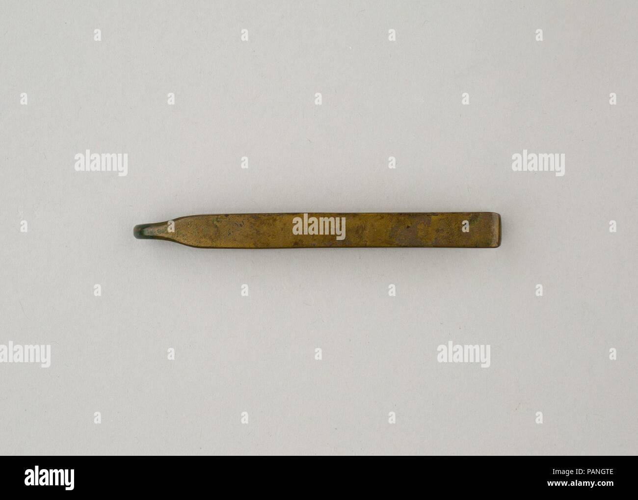 Tweezers. Dimensions: L. 7.2 cm (2 13/16 in); W. 1.2 cm (1/2 in); H. 0.7 cm (1/4 in). Dynasty: Dynasty 18, early. Reign: reign of Ahmose-Joint reign. Date: ca. 1550-1458 B.C..  This set of tweezers is a set of toiletry equipment (26.7.837a-d) that included a razor, a mirror and a whetstone, and a kohl tube (26.7.1447), all found in a rush basket. Museum: Metropolitan Museum of Art, New York, USA. Stock Photo