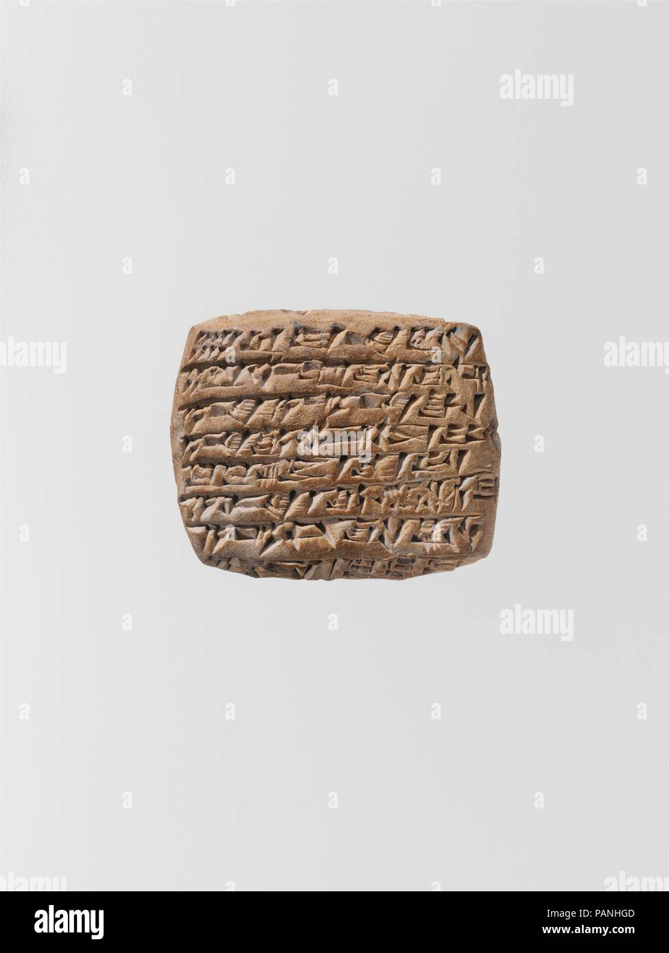 Cuneiform tablet: quittance. Culture: Old Assyrian Trading Colony. Dimensions: 3.7 x 4.5 x 1.4 cm (1 1/2 x 1 3/4 x 1/2 in.). Date: ca. 20th-19th century B.C.. Museum: Metropolitan Museum of Art, New York, USA. Stock Photo