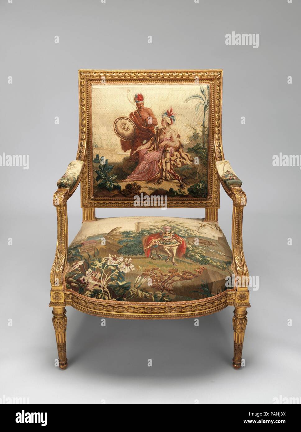 Armchair. Artist: After a composition by Jean Jacques François Le Barbier (French, Rouen 1738-1826 Paris). Culture: French, Beauvais. Dimensions: Overall: 37 3/4 × 27 × 24 in. (95.9 × 68.6 × 61 cm). Factory: Tapestry upholstery by Beauvais. Maker: Workshop of de Menou (French, active 1780-93). Patron: Commissioned for Louis XVI, King of France (French, Versailles 1754-1793 Paris). Date: designed ca. 1786, woven 1790-91; chair frame second half 19th century.  Commissioned by Louis XVI, this ensemble belongs to a set of four wall hangings (1978.404.1-.4) and fifty-six pieces of furniture upholst Stock Photo