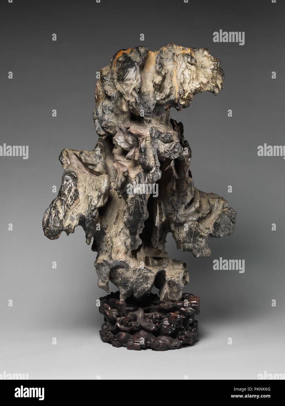 Rock in the Form of a Fantastic Mountain. Culture: China. Dimensions: H. (with stand) 32 in. (81.3 cm); W. 21 in. (53.3 cm); D. 15 in. (38.1 cm). Date: 18th century. Museum: Metropolitan Museum of Art, New York, USA. Stock Photo