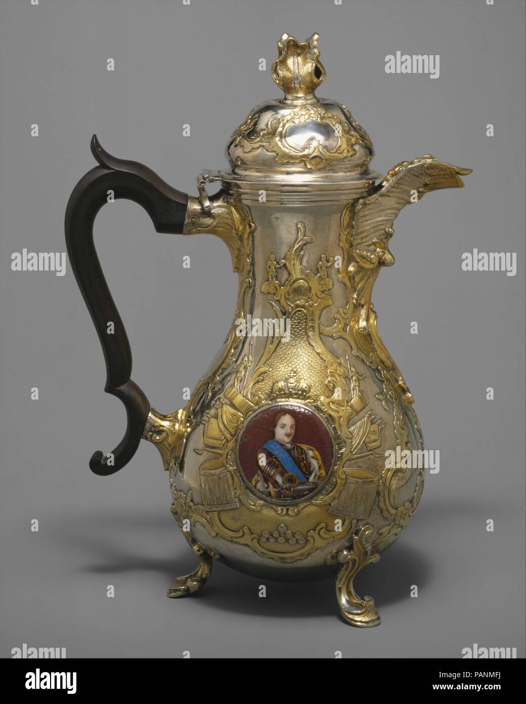 Coffeepot (part of a set). Artist: After a painting by Pietro Rotari (Italian, Verona 1707-1762 St. Petersburg). Culture: Russian, St. Petersburg. Dimensions: Height: 10 1/4 in. (26 cm). Maker: Johan Henrik Blom (Finnish, master 1766, died 1805). Date: 1773.  The service (47.51.1-.5) is thought to have been given by Empress Catherine II to Count Pyotr Rumiantsev, governor of the Ukraine and leader of the victorious Russian forces in the war with Turkey (1768-74). Enamel portraits on the utensils depict the imperial line from Peter the Great to Catherine II to her son, later Paul I. Facing are: Stock Photo