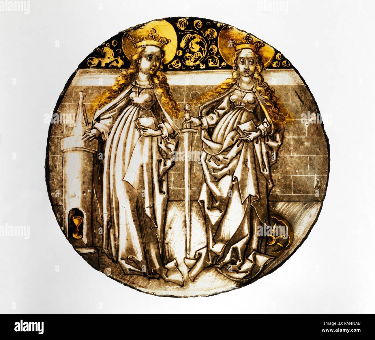 Roundel with Saints Barbara and Catherine. Culture: German. Dimensions: 6 1/4 × 1/16 in. (15.9 × 0.2 cm). Date: ca. 1500-1510.  The artist who painted this roundel, probably from Swabia in southwestern Germany, had a sure command of multiple techniques including point of brush, stylus and stick work, badger brushing and other reductive means of texturing unfired mattes as well as of silver stain. Another roundel of exactly the same size and subject is now in the Bayerisches Nationalmuseum, Munich. When one scale image is overlaid with the other the outlines correspond precisely indicating that Stock Photo