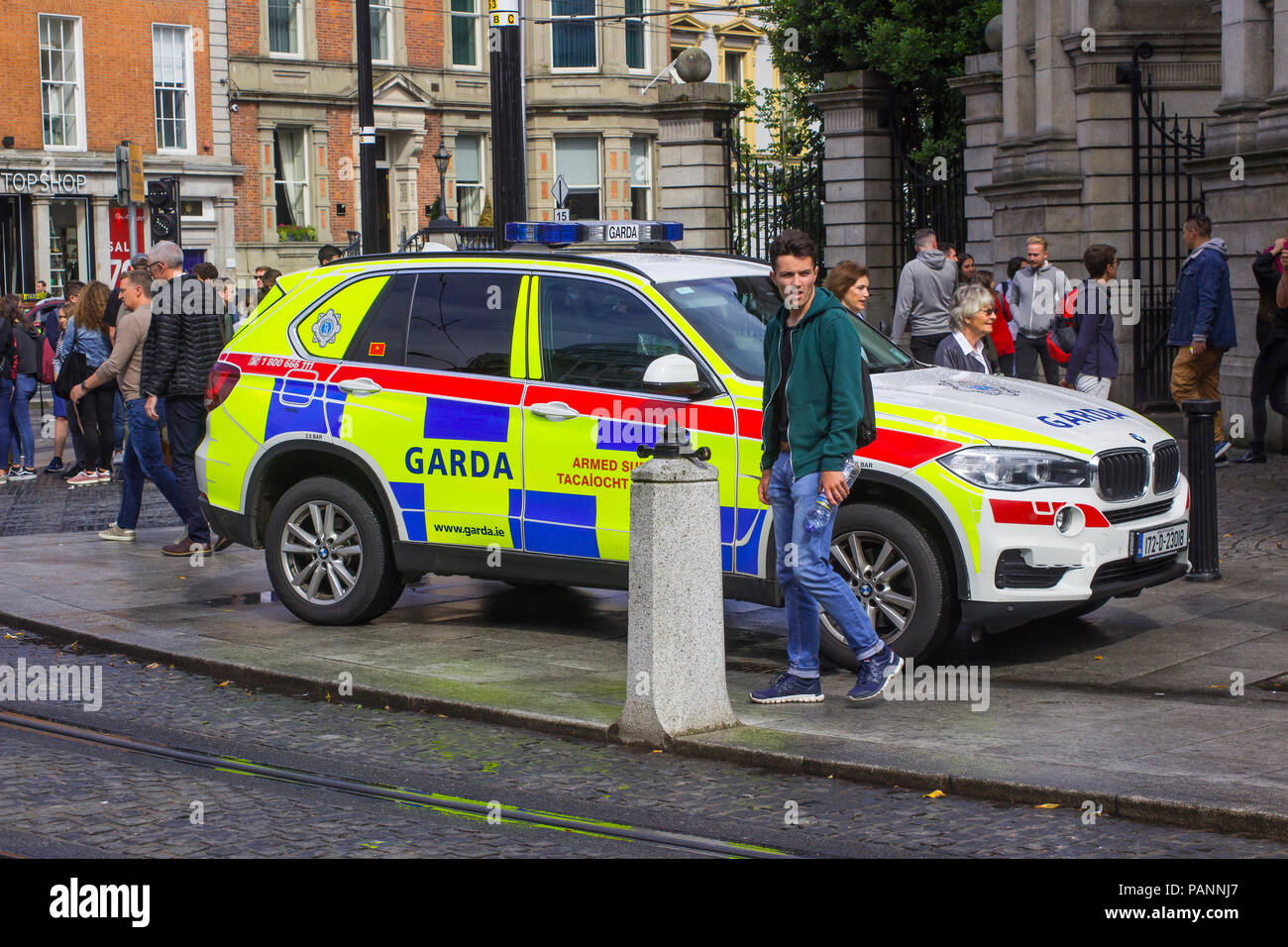 20 July 2018 An Irish police car parked on the pavement while the Garda answer an emergency in Phoenix Park Dublin Ireland Stock Photo