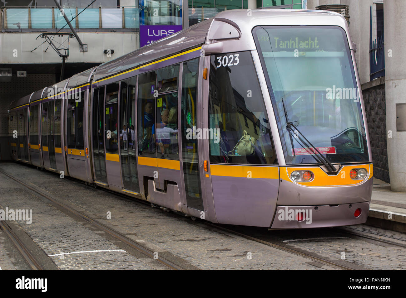 A Dublin Tram that is part of the very successful and efficient Luas city transport system waiting outside Connolly Rail Station Stock Photo