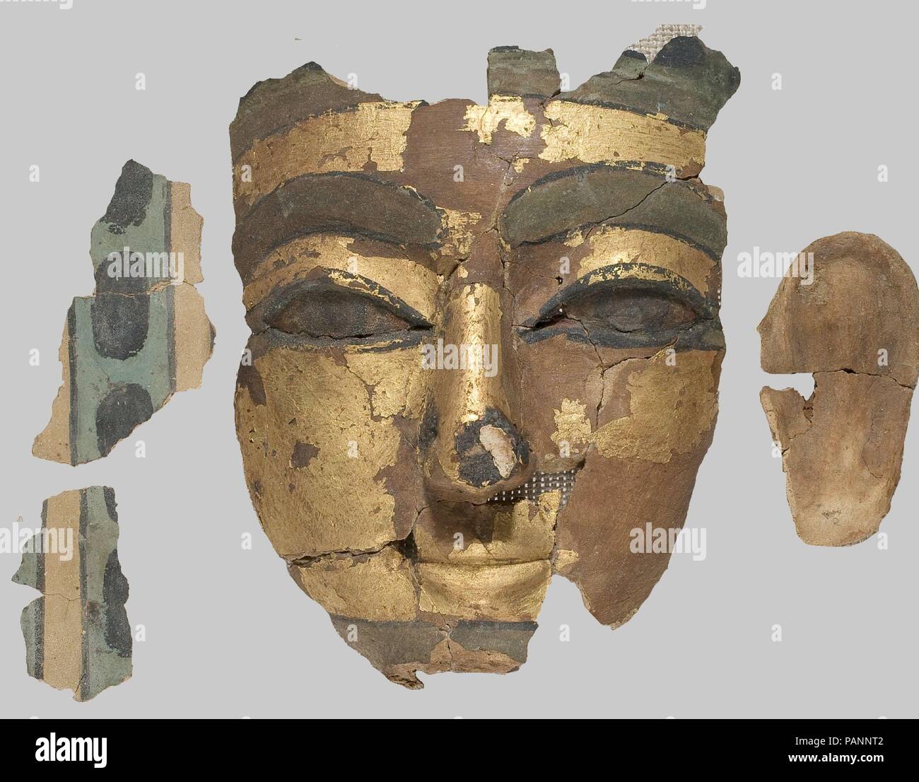 Mask. Dimensions: l. 6.5 cm (2 9/16 in); w. 6 cm (2 3/8 in). Dynasty: Dynasty 18. Date: ca. 1550-1295 B.C.. Museum: Metropolitan Museum of Art, New York, USA. Stock Photo