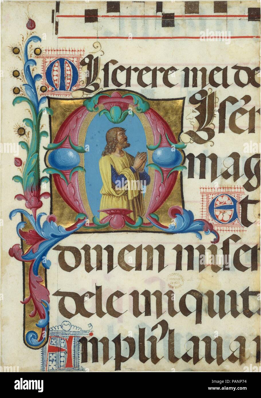 Manuscript Illumination with David in Prayer in an Initial M, from a Psalter. Artist: Girolamo dai Libri (Italian, Verona 1474-1555 Verona). Culture: Italian. Dimensions: Overall: 8 15/16 x 6 1/4 in. (22.7 x 15.9 cm)  Illumination: 3 3/16 x 3 1/8 in. (8.1 x 8 cm)  Mat: 19 3/16 x 14 3/16 in. (48.7 x 36.1 cm). Date: 1501-2.  Like the singing monks in Girolamo dai Libri's miniature executed for the same psalter (displayed nearby), David appears here in prayer with his mouth open and his gaze turned heavenward. In many images of David, God the Father appears above him as the object of his inspirat Stock Photo