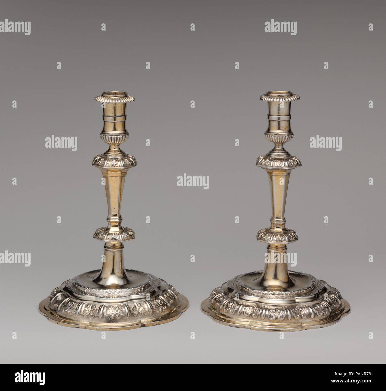 Candlestick (one of a pair). Culture: Swedish, Uppsala. Dimensions: H. 8 1/2 in. (21.5 cm.); D. standing 5 3/4 in. (15 cm). Maker: Master 'RW' (Swedish, Upsala, early 18th century). Date: ca. 1710-20.  Early-eighteenth-century Swedish silver of such a commanding quality is exceedingly rare. These refined candlesticks reflect the stylistic adaptations and the high standard of craftsmanship of the master gold- and silversmiths in Uppsala, a northern European university town. The objects' delicate ornamental vocabulary constitutes an elegant and refreshing version of what could be defined as a Sw Stock Photo