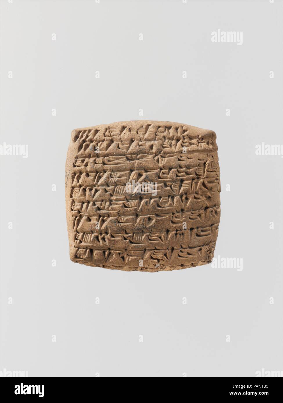 Cuneiform tablet: quittance for a loan in silver. Culture: Old Assyrian Trading Colony. Dimensions: 4.6 x 4.7 x 1.5 cm (1 3/4 x 1 7/8 x 5/8 in.). Date: ca. 20th-19th century B.C..  Kültepe, the ancient city of Kanesh, was part of the network of trading settlements established in central Anatolia by merchants from Ashur (in Assyria in northern Mesopotamia) in the early second millennium B.C. Travelling long distances, and often living separately from their families, these merchants traded vast quantities of goods, primarily tin and textiles, for Anatolian copper and other materials. Although th Stock Photo
