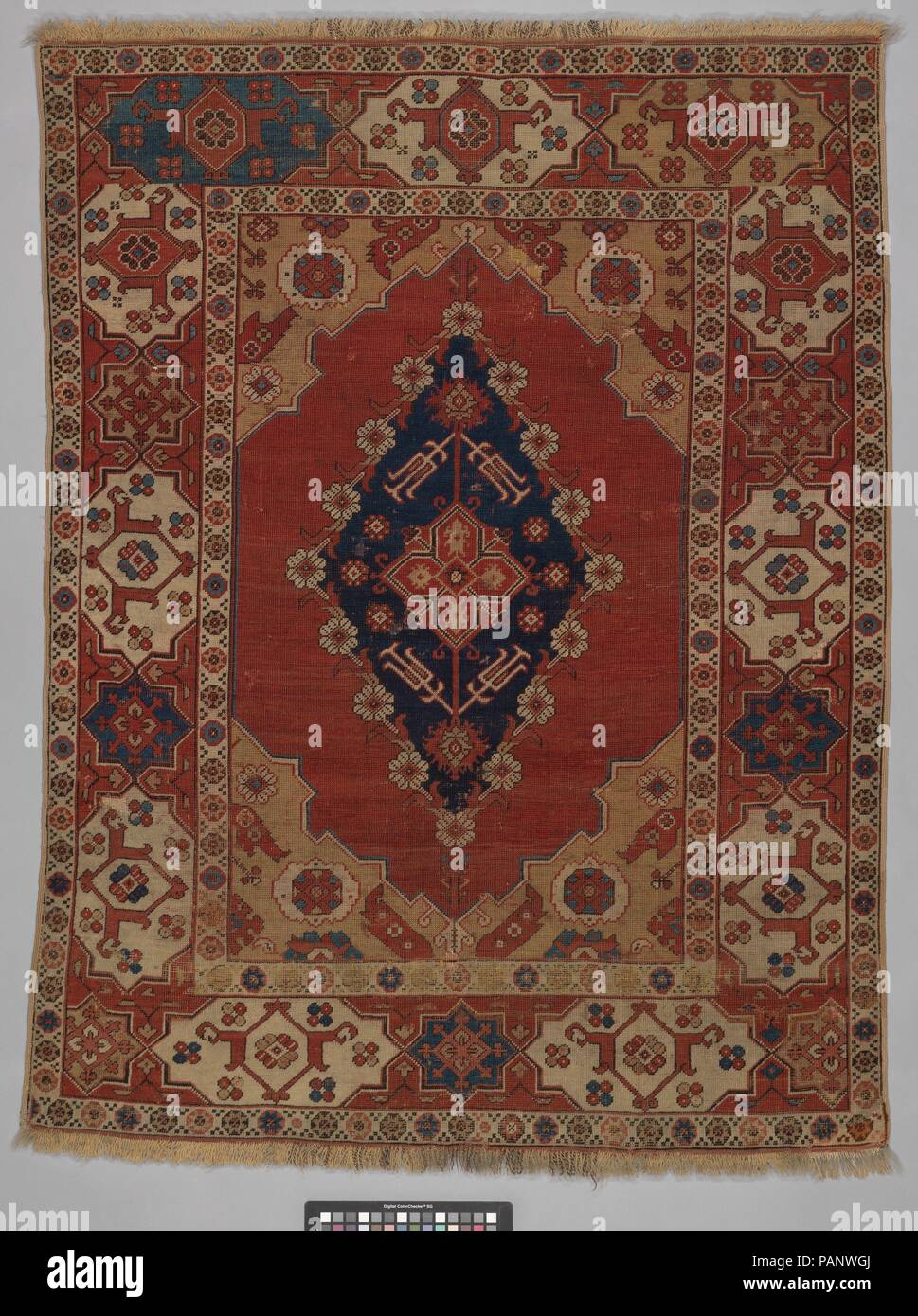 Carpet. Dimensions: Rug: H. 63 1/2 in. (161.3 cm)  W. 47 1/2 in. (120.7 cm). Date: 18th century.  Sometimes called 'Transylvanian' carpets because many examples were found in central European churches of Hungary and Romania, where they were votive gifts, small carpets like this are often depicted in European portraits of the sixteenth and seventeenth centuries draped over tables; later carpets such as this one are more infrequently encountered in paintings. Museum: Metropolitan Museum of Art, New York, USA. Stock Photo