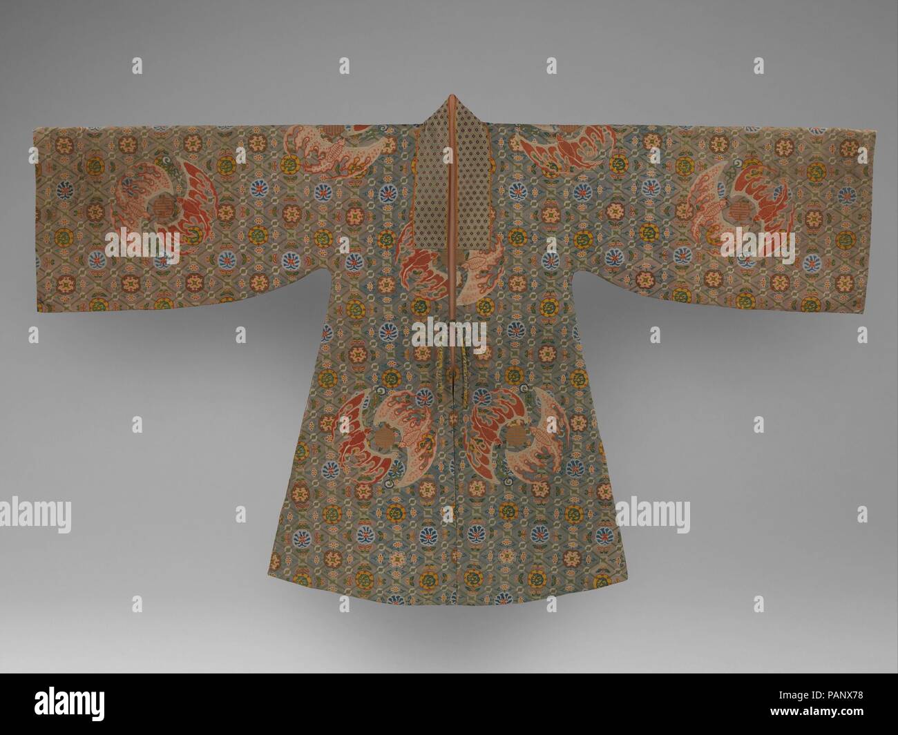 Theatrical Robe for a Male Role. Culture: China. Dimensions: Overall: 55 3/8 x 89 1/4 in. (140.7 x 226.7 cm). Date: second half of the18th century.  This theatrical robe was designed to be worn by an elite male on a casual occasion. Its original form was derived from a long jacket of the Ming dynasty (1368-1644). It is beautifully embroidered using the needlepoint technique and is similar in color and pattern to Qing court theatrical costumes, now at the Palace Museum, Beijing. Museum: Metropolitan Museum of Art, New York, USA. Stock Photo