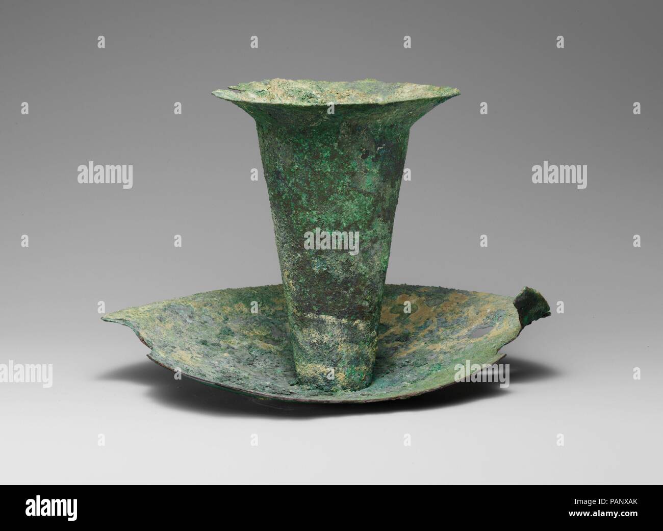 Bronze thymiaterion (incense burner). Culture: Cypriot. Dimensions: 6in. (15.2cm)  Other (diameter of mouth): 4 3/4in. (12.1cm)  Other (diameter of saucer): 8 5/8in. (21.9cm). Date: 6th century B.C..  This example represents the typical Cypriot form of incense burner, attested in terracotta as well as bronze. The shape was known in Cyprus during the Late Bronze Age and was evidently reintroduced during the Archaic period by the Phoenicians. Museum: Metropolitan Museum of Art, New York, USA. Stock Photo