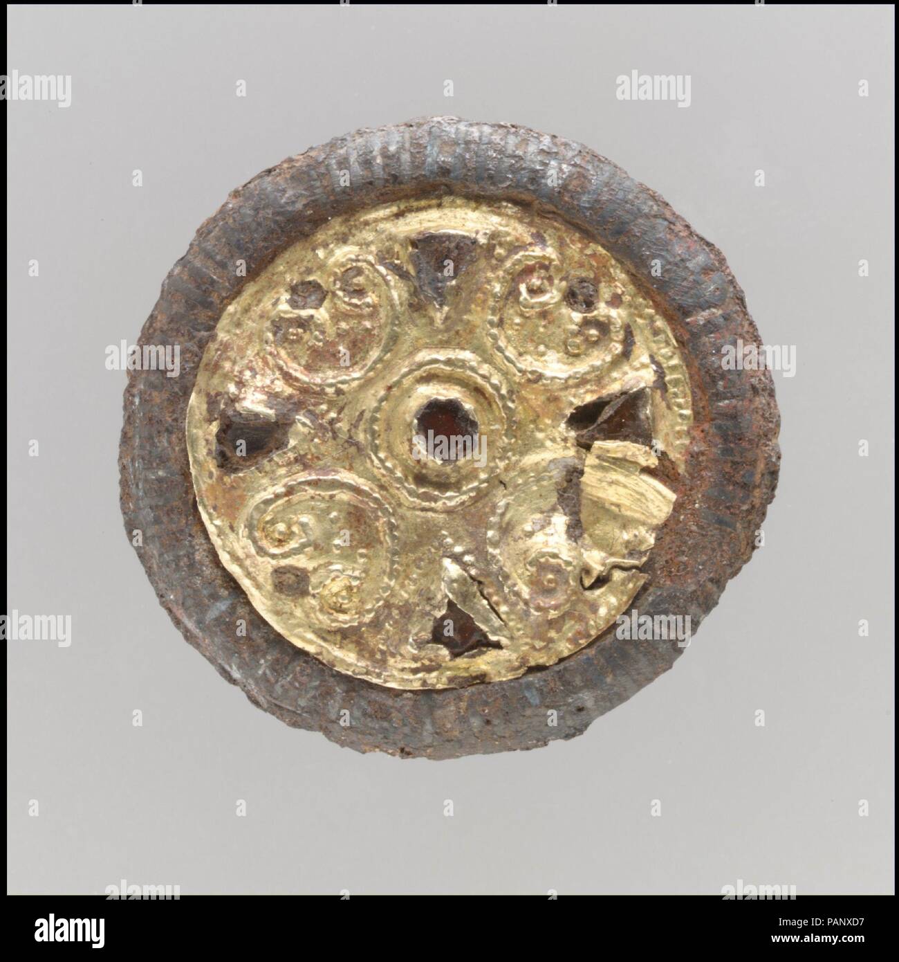 Disk Brooch. Culture: Frankish. Dimensions: Overall: 1 3/16 x 3/8 in. (3 x 0.9 cm). Date: late 6th-early 7th century. Museum: Metropolitan Museum of Art, New York, USA. Stock Photo
