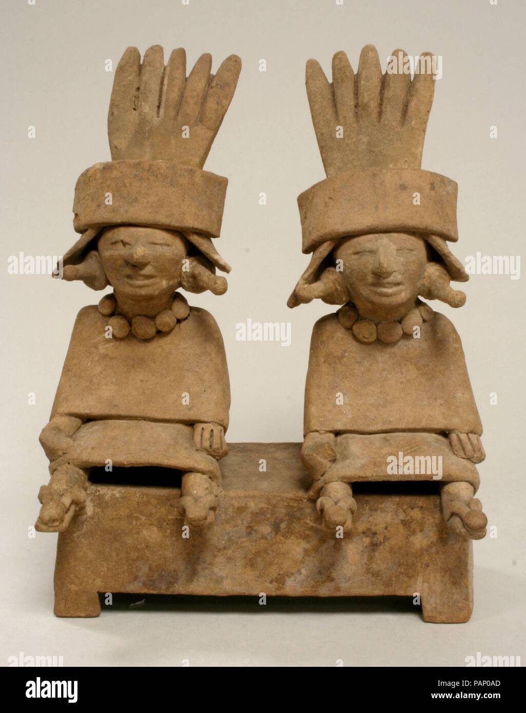 Two Ceramic Figures Seated on a Bench. Culture: Remojadas. Dimensions: H. 8 13/16 x W. 6 7/8 x D. 4 in. (22.5 x 17.5 x 10.2 cm). Date: 6th-9th century. Museum: Metropolitan Museum of Art, New York, USA. Stock Photo