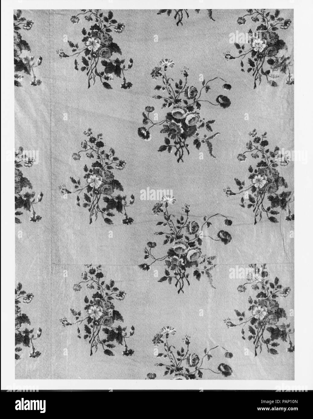 Wholecloth coverlet. Culture: American or British. Dimensions: 93 1/2 x 82 1/4 in. (237.5 x 208.9 cm). Date: ca. 1830.  The coverlet top is of a glazed floral chintz; it has a beige ground printed with red, blue, and yellow flowers and green foliage. The back is randomly pieced of two chintzes and two brown and red calicos. A piece of the same chintz used for the top is pieced into the back and is inscribed with the fabric printer's name. The edges of the top and back are bound together with striped tape. The coverlet has no batting between the top and back layers and is not quilted. Museum: M Stock Photo