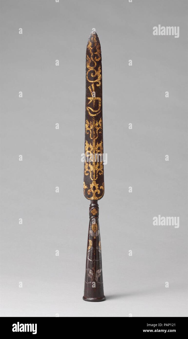 Spearhead (Mdung Rtse). Culture: Tibetan. Dimensions: L. 18 1/4 in. (46.4 cm). Date: 17th-18th century.  This spearhead was probably made for use by an oracle, or in another ceremony or ritual involving the propitiation of a deity, as indicated by its form and decoration, and particularly by the prominently placed word <i>kyai</i>, written in a Tibetan script. This symbol, known as a seed syllable, was sometimes used to invoke a deity in ritual contexts. Museum: Metropolitan Museum of Art, New York, USA. Stock Photo